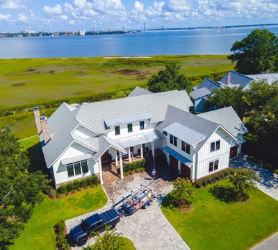 Capturing Videography And Photography With An Aerial House Image From A Shoot